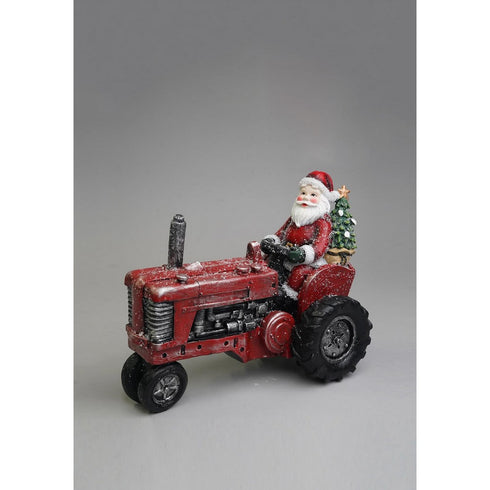 Santa in tractor w/xmas tree 25x14x20cm
