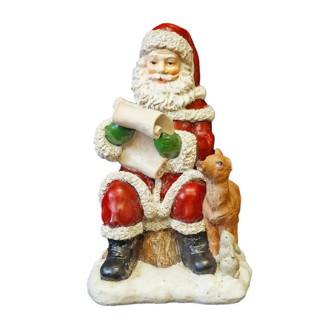 Polyresin Santa reading his list with Deer and Rabbit
